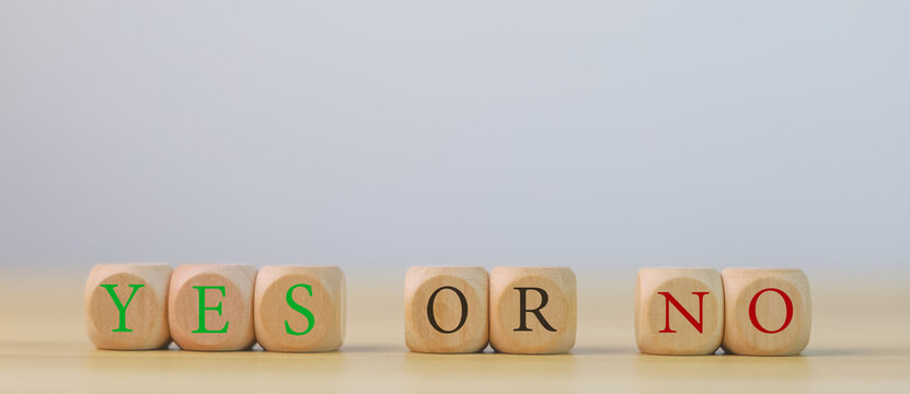 wooden block yes or no symbol and checkmark Alternative concepts, decision making, and true and false test questions.