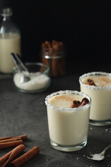 Two glasses with traditional Puerto Rico cocktail Coquito	