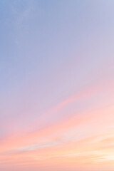 beautiful romantic view of pastel pink orange blue colored sky and clouds in the coast of Costa Rica