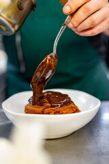 chef cooking dessert in the kitchen