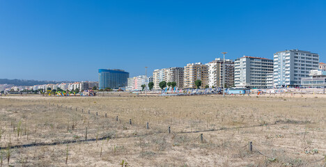Amazing panoramic view of Figueira da Foz, Claridade beach with pedestrian walkways and main Brazil avenue, along the seafront with buildings