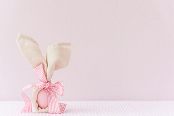 Easter product display mockup background with bunny easter egg on pink cover background.