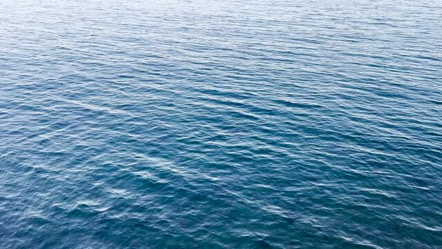 Blue ocean water surface as background