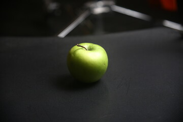 green apple on black background