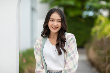 Beautiful asian young woman smile and cheerful. Confident cute female looking at camera relax and happiness with wellness life. good moment and positive emotional. Happy woman enjoy her life concept