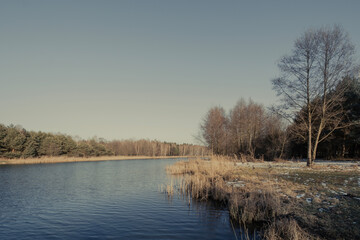 The end of winter, a small dam reservoir, a fishing ground in Poland.