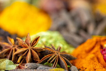 Various spices, peppers and herbs close-up top view. Eastern spice market. A set of peppers and spices for cooking.