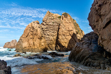 Fototapeta na wymiar Rock cliffs from Praia da Ursa beach on coast of Portugal