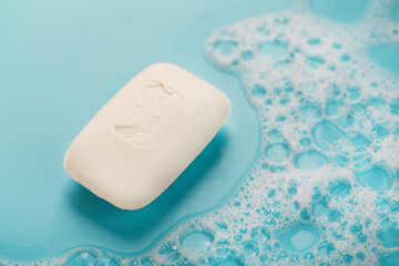 Scented white soap with a seahorse pattern with foam