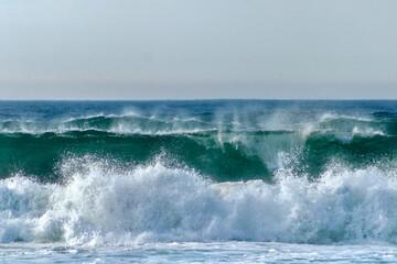 Waves on the blue green atlantic ocean off the coast of portugal