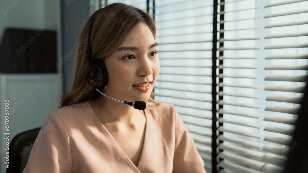 Aufkleber competent female operator working on computer and while talking with clients. concept relevant to bo