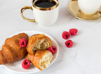 Morning with a cup of coffee and croissants. On a white background. Breakfast.