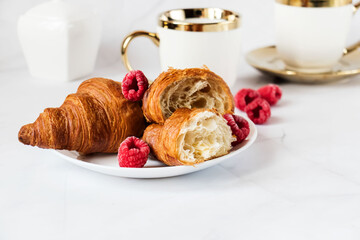 Morning with a cup of coffee and croissants. On a white background. Breakfast.
