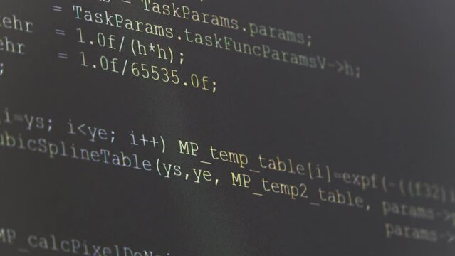Computer Source Code scrolls on a screen.