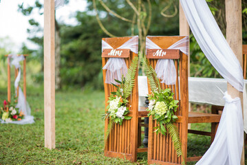 amazing outdoor wedding sign table with couple chairs close up