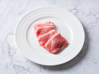 Fresh sliced raw tuna on plate