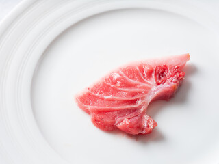 A piece of fresh tuna on a plate