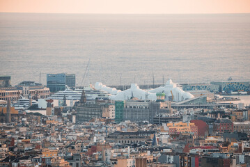 Aerial view of beautiful seascape and buildings at the Moll de Gregal del Port Olympic in Barcelona, Catalunya, Spain during sunset