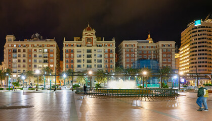 Fototapeta na wymiar Night view of Marina Plaza square in the Mediterranean city of Malaga, Spain.