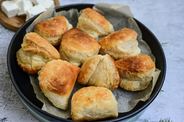 Fresh baked home made  Mini cheese puff pastries.Cheese pie with phyllo pastry and herbs