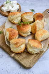 Fresh baked home made  Mini cheese puff pastries and cream  spread cheese.Cheese pie with phyllo pastry and herbs