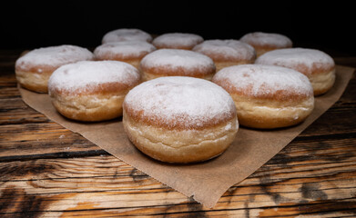 Polish pączki deep-fried doughnuts. Celebrating Fat Thursday (Tłusty czwartek) feast, traditional...