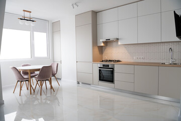 Modern Contemporary kitchen room interior .white and wood material. real new interior design