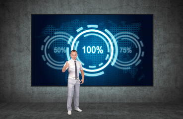 Businessman showing thumbs up and analytics data and percentage charts on screen in concerete interior. Analytics and exchange concept.
