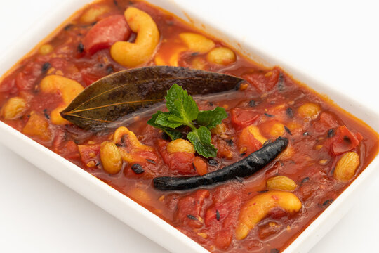 Bengali Style Sweet Sour And Spicy Tomato Chutney Also Called Tamatar Ki Khatti Meethi Chatney Or Chutni Bhoger Prasad Prepared Primarily From Fresh Tomatoes, Dry Fruits And Spiced With Garam Masala