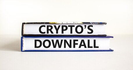 Crypto downfall symbol. Concept words Cryptos downfall on books. Beautiful white table white background. Business and crypto downfall concept. Copy space.
