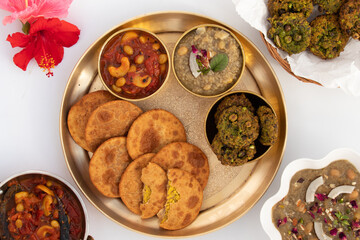 Dal Bhari Poori, Dholl Puri, Cholar Dal, Luchi Served With Gur Ki Kheer Or Jaggery Rice Pudding, Nolen Gurer Payesh, Rasiyaw, Payasam, Hara Chana Or Chholia Pakoda Bhabhra, Tamatar Ki Meethi Chutney