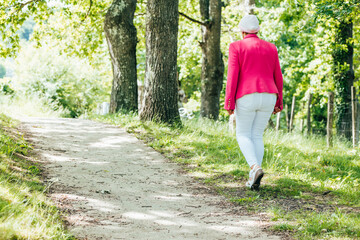 sick woman walks in nature