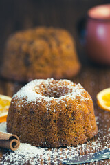 Coconut sprinkled cake on wooden background	
