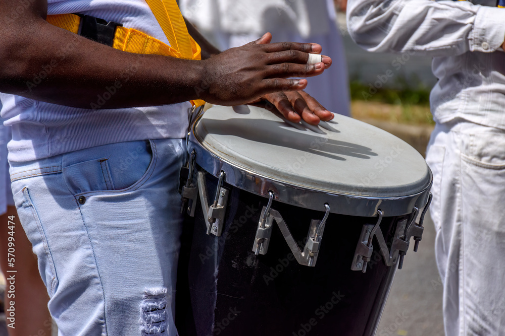 Wall mural Atabaque drum player in the streets of Brazil during brazilian samba presentation