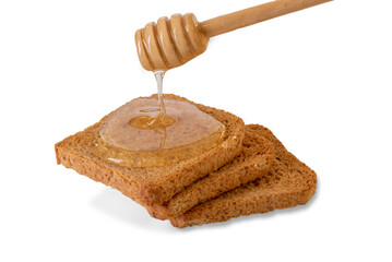 Acacia honey dripping from honey dipper on toast bread slices, isolated on white , clipping path