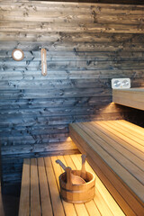 Interior of Finnish sauna. Front view of classic wooden sauna. Relax in hot sauna with dry steam