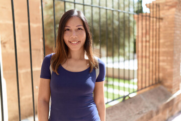 Young asian woman smiling confident standing at street