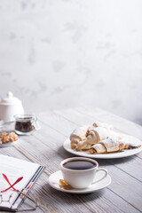 breakfast with coffee and croissants while reading a book