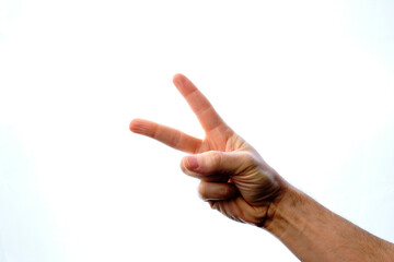 Close-up of a man's hand with the victory sign, on a white background.