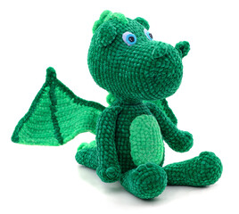 Green knitted dragon toy.