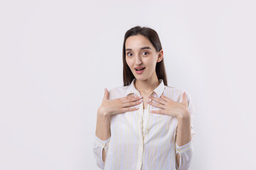 Young beautiful woman with facial expression of surprise standing over white background.