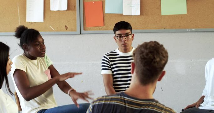 amazonian indian sailing in a canoe on a river in the jungle during sunset
