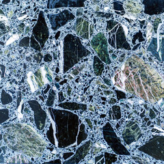 Texture of shards of black and green stones and granite chips