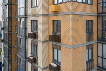 Obraz premium Building exterior with decorative air conditioner covers