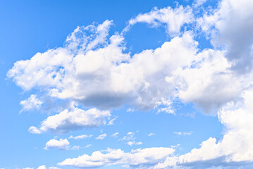 White clouds in a bright blue sky. The beauty of the nature	