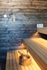 Interior of Finnish sauna. Front view of classic wooden sauna. Relax in hot sauna with dry steam