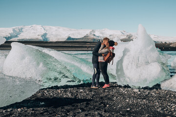 Couple kissing at Glacier Lagoon Jokulsarlon, Iceland