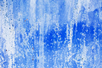 Rusty metal abstract background. Texture of an old blue grunge metal plate with cracked paint.