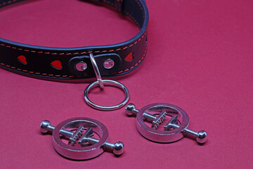 black leather collar and steele nipple clamps