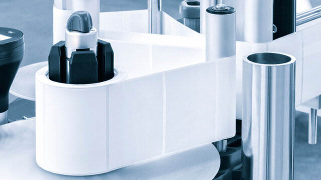  Fragment of the conveyor of sticking labeling machine. Abstract industrial background.